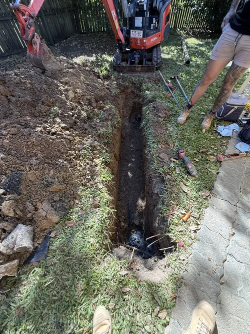 blocked drain emergency being fixed in Everton Park