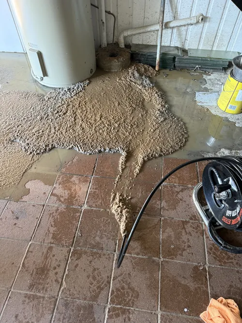 blocked sewer drain being cleared in brisbane property