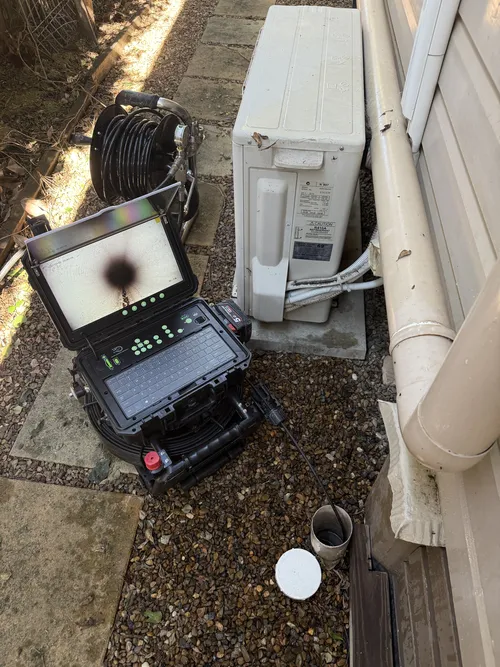 plumber performing CCTV drain camera inspection in Albany Creek