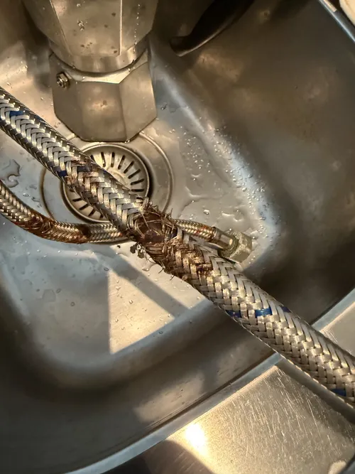 burst flexi hose in a kitchen